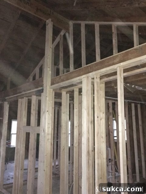 Creating distinct sections in the new loft space Framing the new loft area division