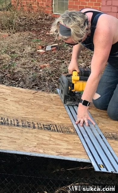Enjoying the weather while preparing subfloor Cutting subfloor outdoors in pleasant weather