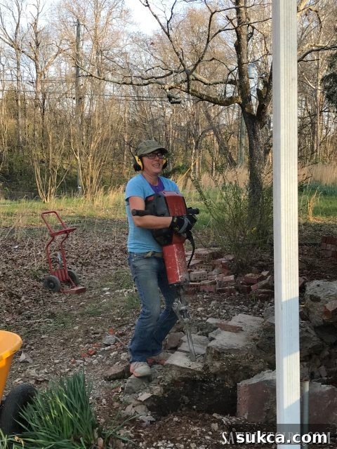 A powerful 80-pound jackhammer, nicknamed 'The Beast,' poised and ready for the intensive concrete demolition work at Calderwood Cottage.