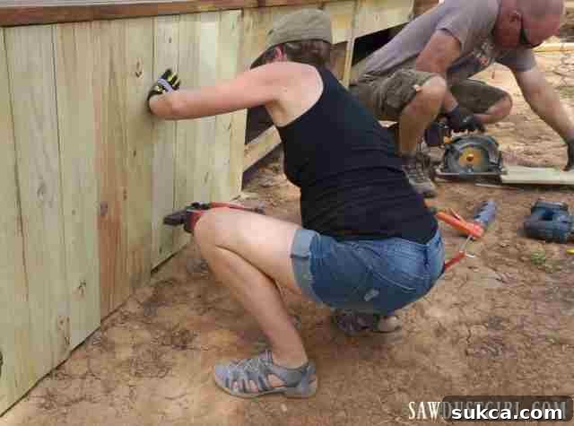 Cedar deck skirting being installed, providing a clean and finished look to the deck's perimeter.