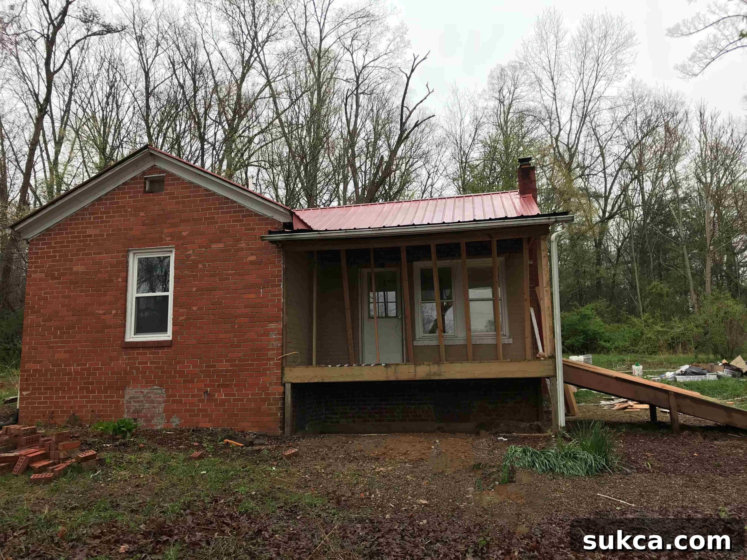 Calderwood Cottage before the deck construction, showing its original state.