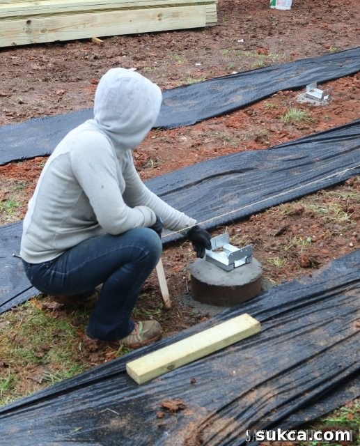 Team working diligently on deck building despite the cold and wet weather conditions.