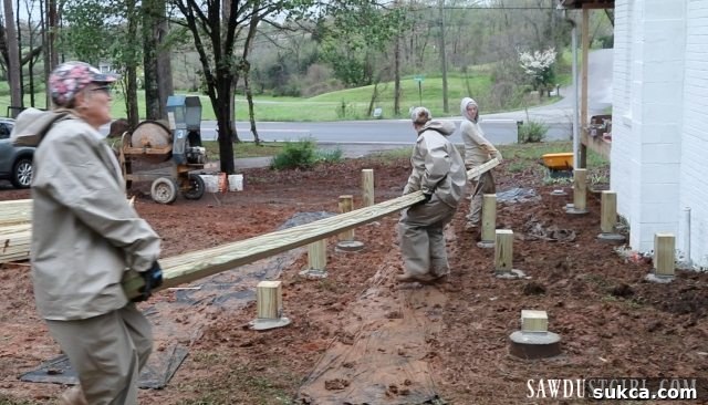 Muddy conditions on the construction site, making the task of carrying deck beams extremely difficult.