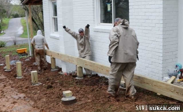 First major deck beam securely installed, forming part of the deck's foundational structure.