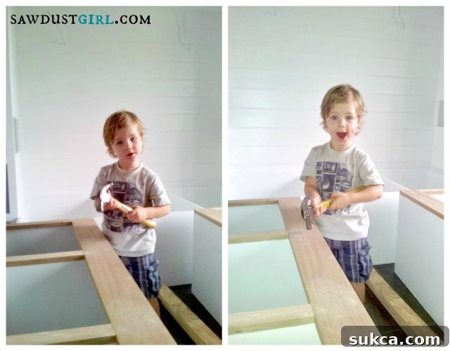 Kristy's child, William, 'helping' with the face frames for the built-in bedroom storage - SawdustGirl.com