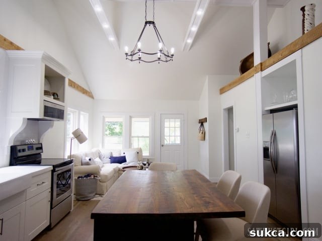 Expansive great room showcasing a stunning cathedral ceiling and open layout