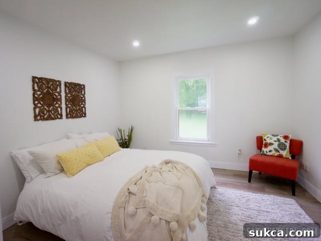 Inviting master bedroom in Calderwood Cottage with natural light