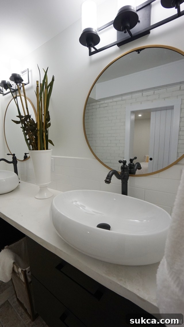 Vertical view of the elegant master bathroom with walk-in shower and unique fixtures