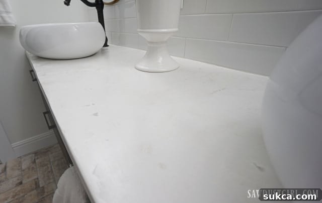 Close-up of the stunning stone-like concrete countertops in the master bathroom