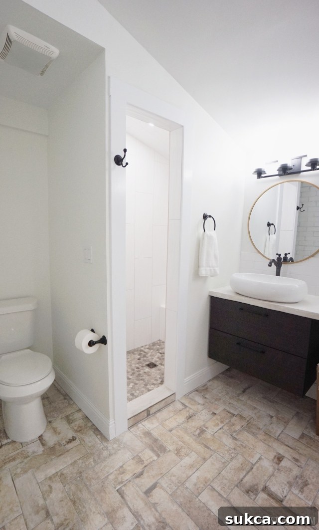 Luxurious walk-in shower in the master bathroom with modern tiling