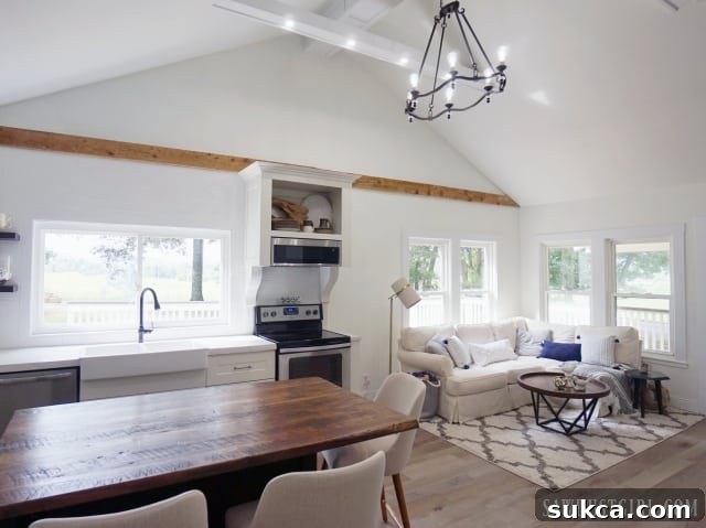 Modern organic minimalist great room featuring open kitchen and living area