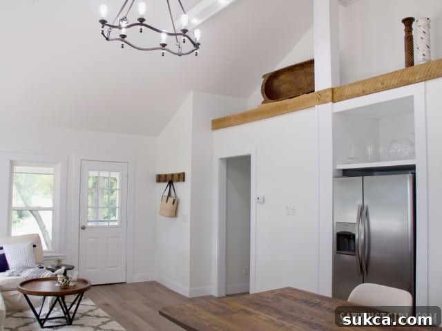 Calderwood Cottage living room with exposed beam and natural light