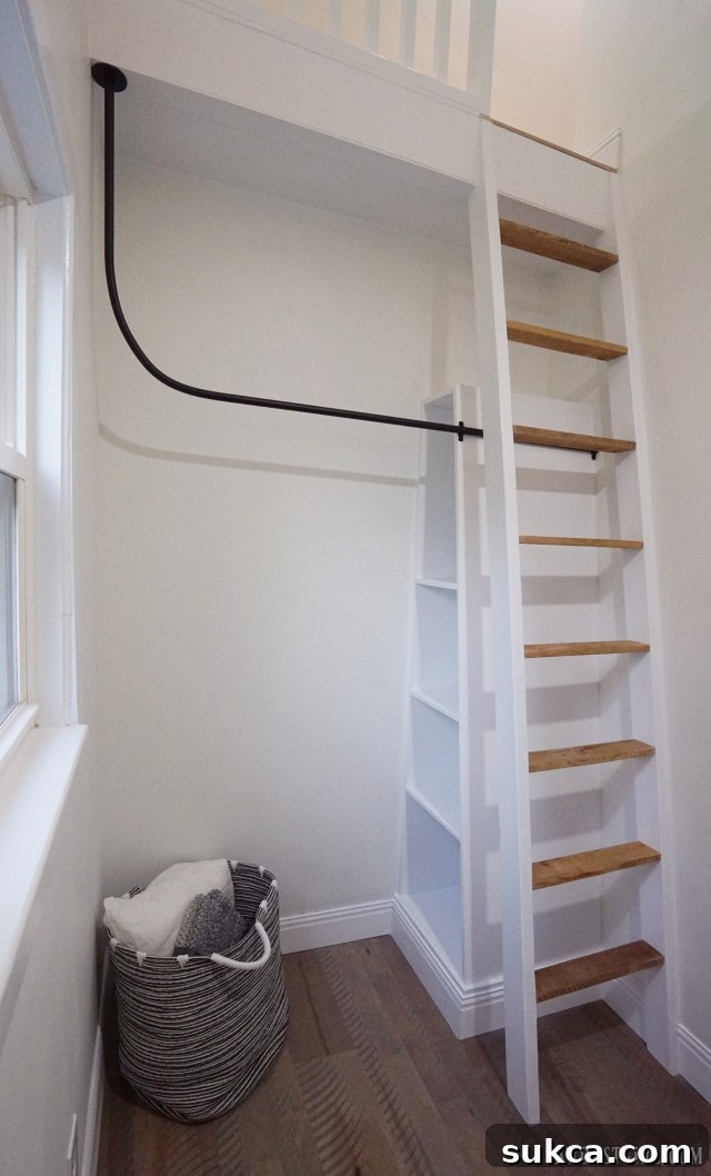 Industrial-style bedroom closet with a unique hanging bar made from electrical conduit