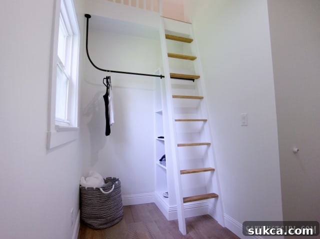 Bedroom loft area with an open closet design, showcasing thoughtful space utilization