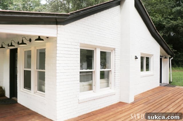 Calderwood Cottage: a stunning white brick home with elegant black accents