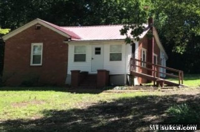 Before image of Calderwood Cottage renovation, showing the enclosed front porch