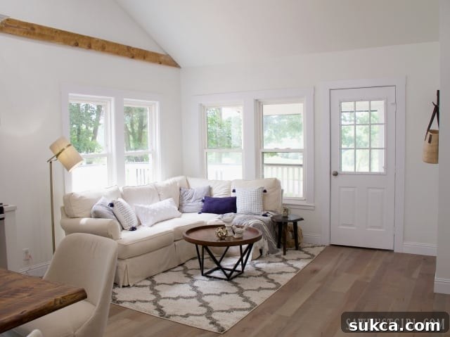 Natural living room decor featuring an exposed wooden beam and cozy furnishings