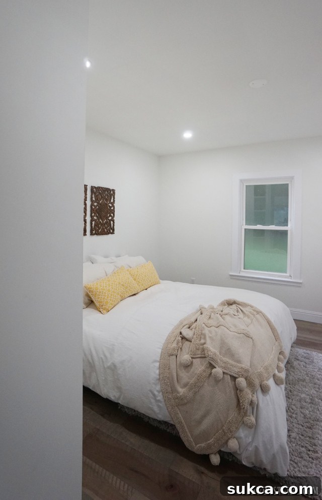 Minimalist bedroom design focusing on simplicity, comfort, and natural light