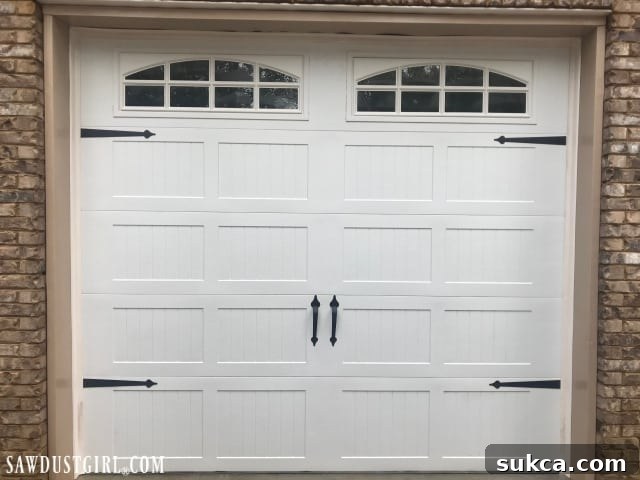 Close-up of a cleaned garage door showing the removal of mildew, highlighting a few remaining stubborn marks on the weather stripping