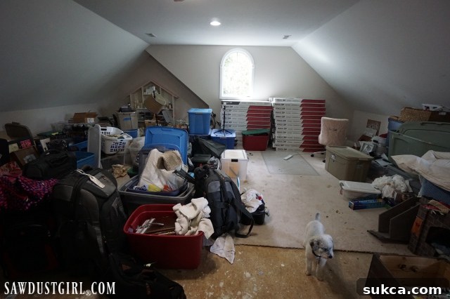 Overwhelmed by clutter in the loft Close-up of the messy loft space before renovation