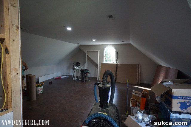 New loft flooring installation complete Newly installed laminate flooring in the loft, covered for protection
