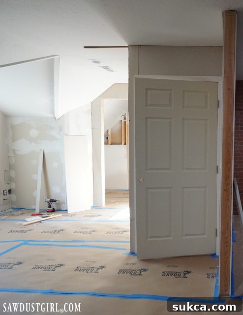 Drywall and door installation in the loft Working on drywall installation in the loft, adding a door