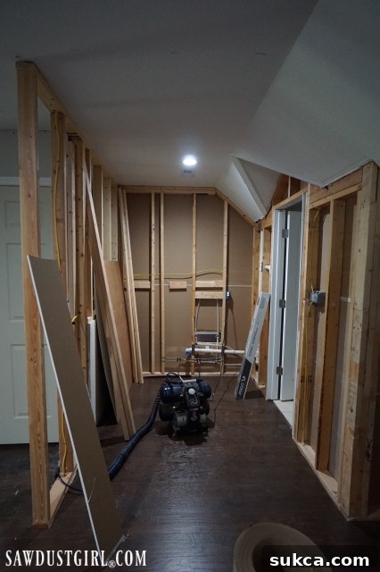 Faux brick paneling in the loft Faux brick paneling being installed on a wall with a sink