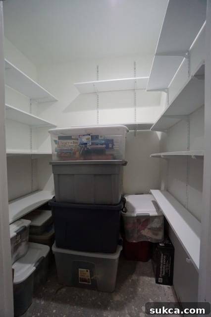 Organized storage closet with stacked bins and clear pathways, showcasing efficient space utilization