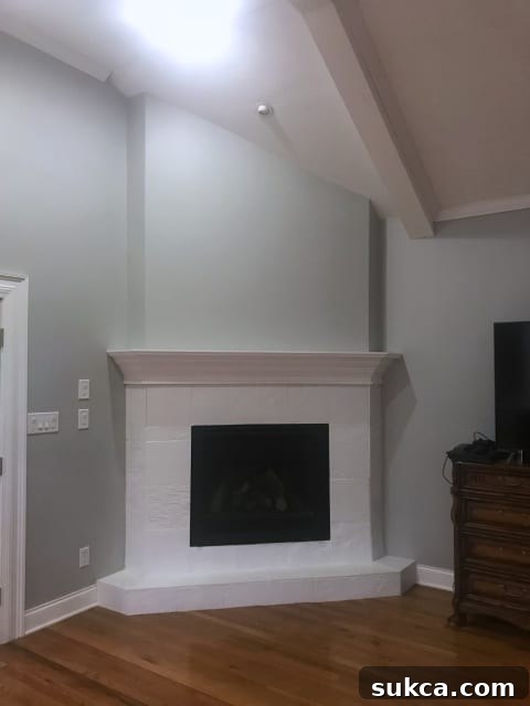 Outdated corner fireplace in a living room, awaiting a modern renovation