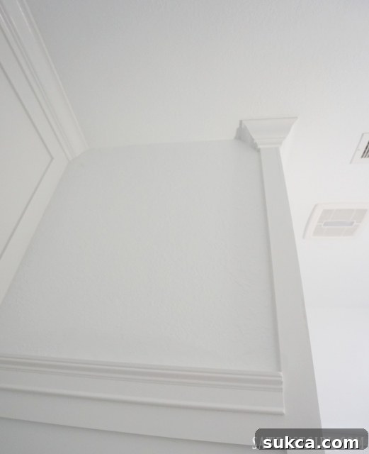 Detailed view of crown molding with a clean return on the tub surround