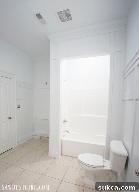 After bathroom renovation featuring new board and batten wainscoting
