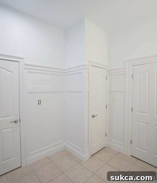 Wider shot of the finished wainscoting in the bathroom