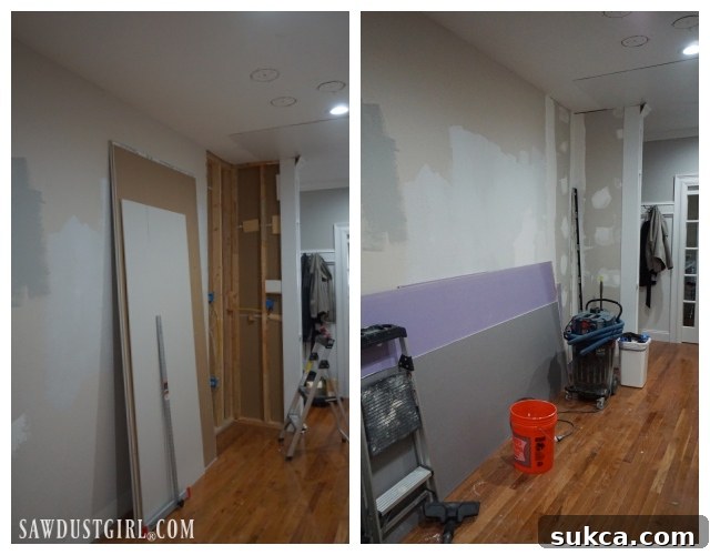 DIY drywall patch in hallway behind kitchen