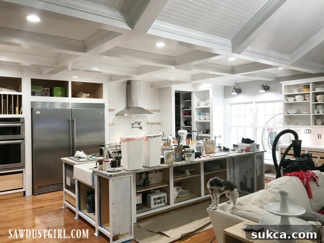 Kitchen renovation progress with repainted cabinets