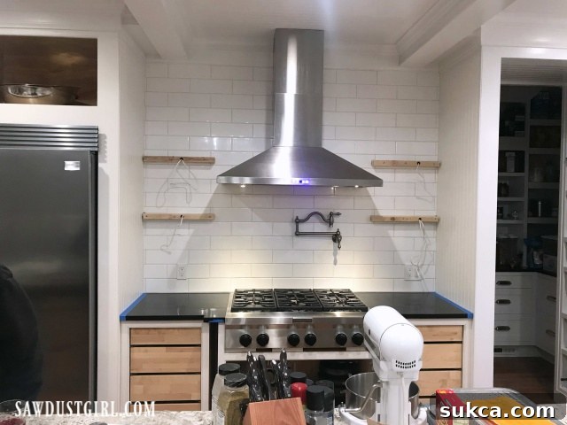 Installing floating shelves in kitchen prior to painting