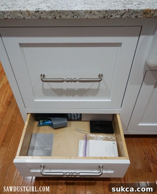 Under-Dishwasher Storage A storage drawer conveniently located beneath a single-drawer dishwasher unit.