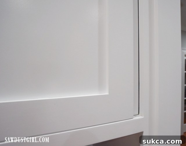 An overhead view of the sliding cabinet door track, illustrating the bypass mechanism and how doors overlap for efficient space utilization.