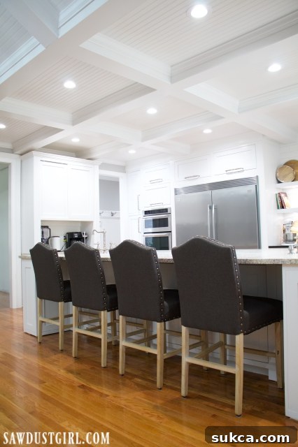 Spacious kitchen island providing ample storage and prep space, complementing the overall kitchen design.
