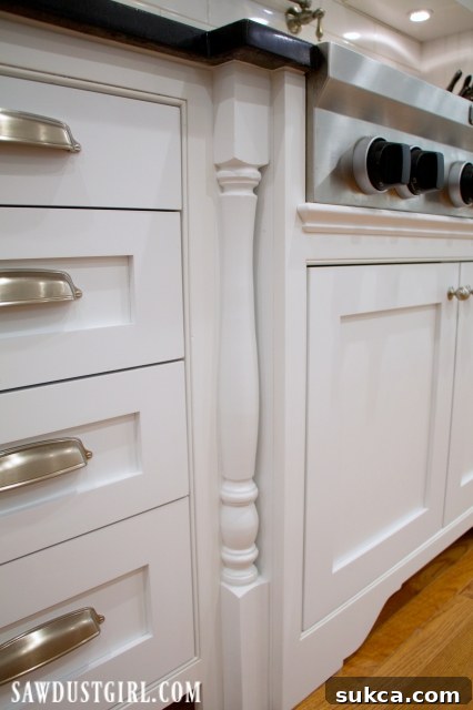 Decorative legs on cooktop cabinet, showcasing the beautiful final installation and custom details