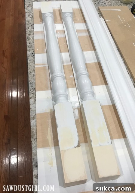 Custom legs for cooktop cabinet after patching and sanding, ready for final paint