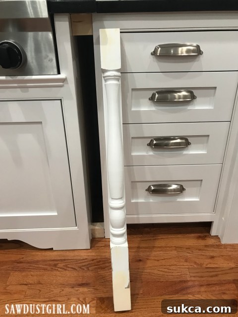 Adding decorative legs around cabinets, showing internal blocking and initial placement for precise fit
