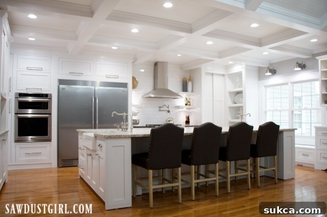 Stunning farmhouse kitchen remodel with white cabinets and rustic touches.