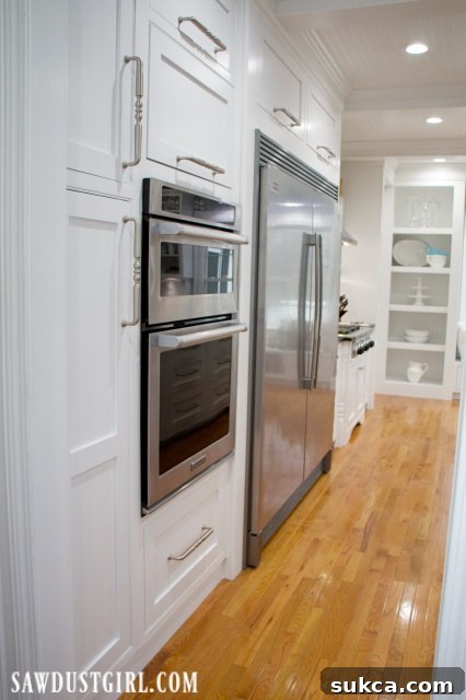 Beautifully renovated kitchen reveal showcasing modern appliances and custom touches.