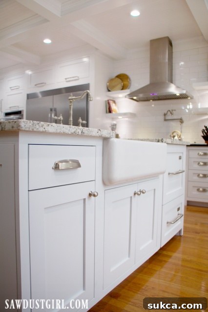 Classic farmhouse sink set within a beautifully designed kitchen island.