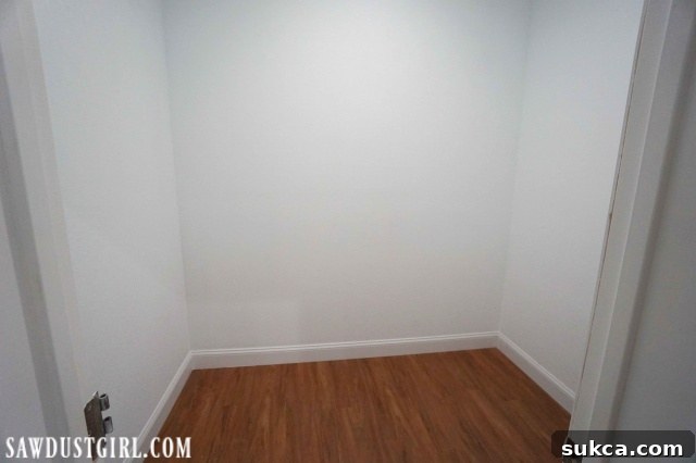 Closet with new drywall, paint, and flooring