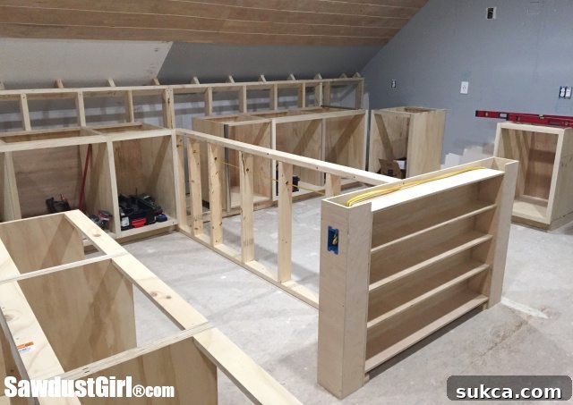 Integrated craft island cabinets showing the wrapping paper storage unit