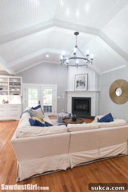 Cozy corner of the living room showcasing custom trim work and comfortable seating arrangement for gatherings