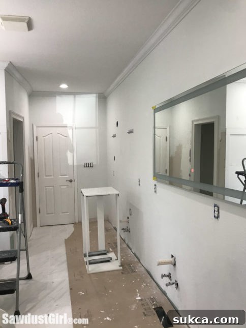 Unfinished master bathroom during rapid renovation, showing a stripped-down interior just before the final push