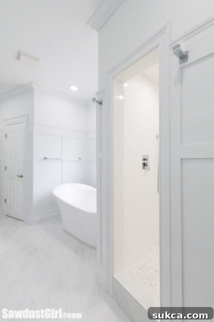 Luxurious master bathroom with a freestanding soaking tub and modern fixtures, providing a true spa experience at home