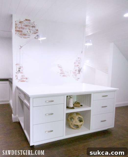 A large fabric storage and cutting table in a well-lit craft room, designed for extensive crafting projects.